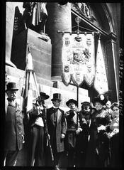Group of Bretons in Paris carrying a banner on the forecourt of Saint-Roch church in 1913