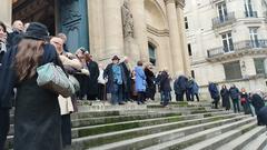 Guests attending the funeral of Niels Arestrup at Saint-Roch Church in Paris