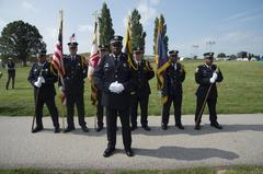 Baltimore City's Honor Guard standing at attention during a 9/11 ceremony at Fort McHenry