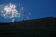 Fireworks exploding over Fort McHenry at night during Baltimore Navy Week 2012 commemorating War of 1812 bicentennial