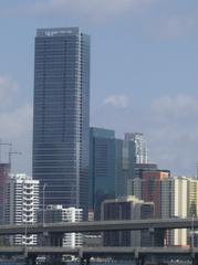Four Seasons Hotel Miami towering over Biscayne Bay in a sunny urban skyline