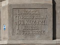 Commemorative plaque on the facade of the Holy Cross Basilica in Warsaw
