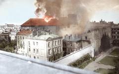 Burning Holy Cross Church during Warsaw Uprising on Krakowskie Przedmiescie street viewed from Czackiego street rooftops
