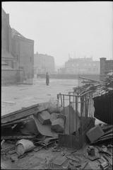 Bomb damaged St George's Roman Catholic Cathedral in Southwark with debris and Father Dixon on site in 1942