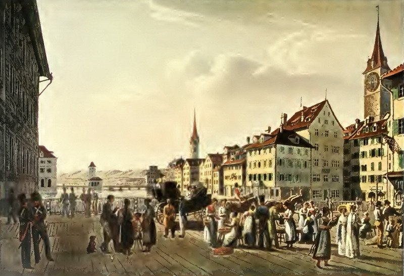 View of Zurich city from Rathausbrücke with the Hotel zum Schwert and the red tower near Weinplatz