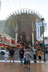 Fremont Street Experience vibrant light canopy at night with crowds and historic buildings