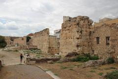 View of Acropolis and Athens Roman Agora with ancient ruins under clear sky