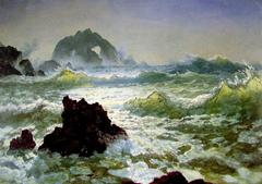 Seal Rock at the coast of California with sea lions resting on the rocks