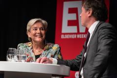 Minister Ank Bijleveld answering questions about the future of Defense in a packed hall during the Defensiedebat 2019