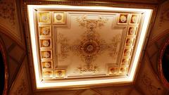 Wide two-lane staircase with stucco ceiling leading to the central hall in Císařské lázně spa, Karlovy Vary