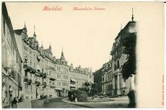 Historic black and white photo of Karlsbad Marienbadstraße street in 1898 showing old buildings and people