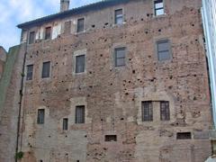 Brick wall with holes where the Forma Urbis Severiana marble slabs were mounted in the former Pax temple in Rome