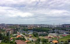 View of Avilés city with historic buildings and green areas