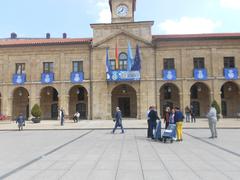 Avilés City Hall decorated with flags of the Real Avilés Industrial football team during the 2025 playoffs