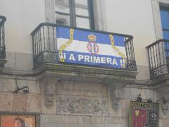 Real Avilés Industrial flag displayed on a balcony