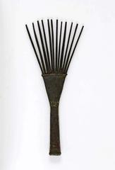 Palmwood hair comb with intricate carved geometric patterns
