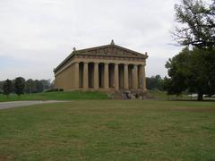 Full frontal view of the Parthenon replica in Centennial Park, Nashville with clear blue sky