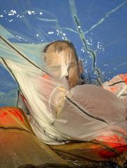 U.S. Air Force air crew member practicing parachute water survival training at Elmendorf Air Force Base