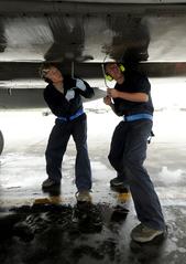 U.S. Air Force airmen performing maintenance on F-15 Eagle fighter jet during Northern Edge 2009 exercise
