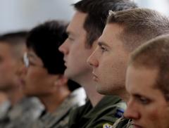 Service members at Elmendorf Air Force Base and Fort Greely Alaska listening to US Defense Secretary Robert M. Gates on June 1, 2009