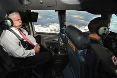 U.S. Defense Secretary Robert M. Gates sitting on the flight deck of a C-17 Globemaster III aircraft