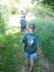 Cub Scout wearing a blue uniform outdoors