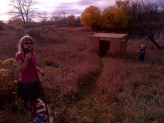 Children playing and exploring nature during outdoor activity