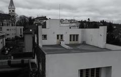 Aerial view of Villa Müller with modernist architecture surrounded by trees and greenery