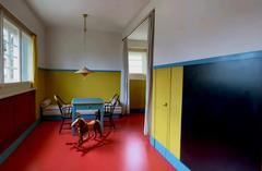 Playroom for children at Villa Müller with colorful toys and furniture