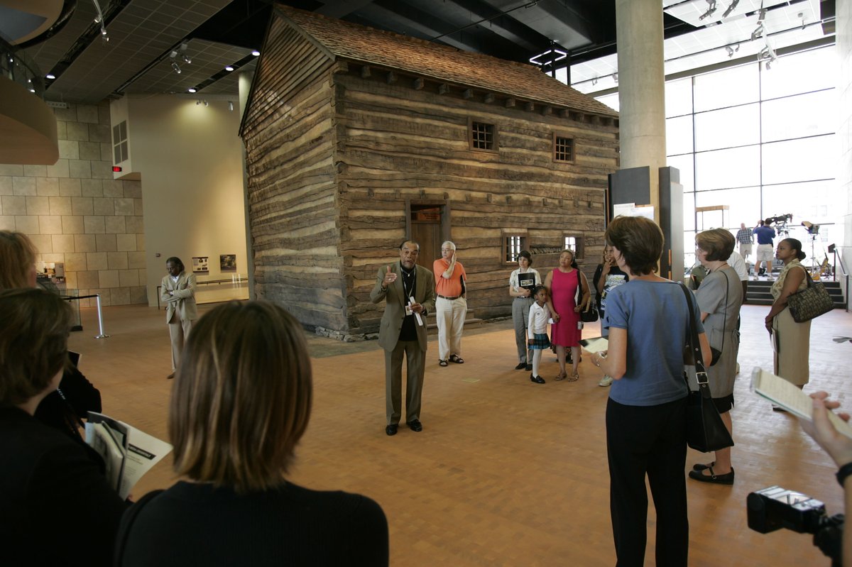 National Underground Railroad Freedom Center patrons learning about a slave pen exhibit in Cincinnati, Ohio