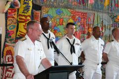 Rear Adm. Ben Wachendorf addressing a tour group at the National Underground Railroad Freedom Center before a reenlistment ceremony