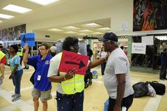 Passengers on Amtrak train receiving warm welcome and directions in New Orleans after evacuation