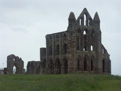 Whitby Abbey ruins on a cliff overlooking the sea in England