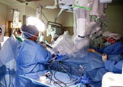 Medical team performing first robotic surgery at William Beaumont Army Medical Center with advanced robotic surgical system