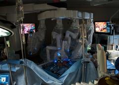 Surgeon performing first robotic minimally-invasive surgery at William Beaumont Army Medical Center using advanced surgical robot