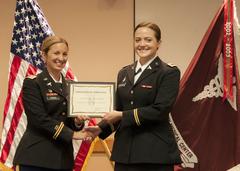 Second Lt. Emily C. Leszczynski receiving completion certificate at William Beaumont Army Medical Center nursing graduation