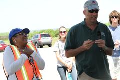 Colonel Paul Olsen thanking Clean the Bay Day organizer Ella Skeeter-Webster at Craney Island Dredged Material Management Area during volunteer event