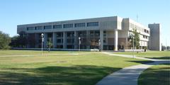 Interior view of the University of New Orleans Library with bookshelves and study areas