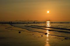 Sunset view of the Port of Zeebrugge from Knokke beach