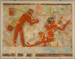 Two men splitting papyrus reeds in ancient Egypt papyrus industry facsimile from the Tomb of Puyemre