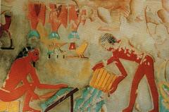 Ancient Egyptian wall painting depicting fish gutting in the Tomb of Pujemre, Thebes
