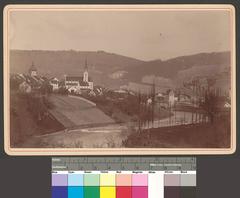 View of the town of Baden with the Limmat River and Landvogteischloss castle, Stadtpfarrkirche Maria Himmelfahrt church and Stadtturm tower in the background, seen from Wettingerbrücke bridge, looking south