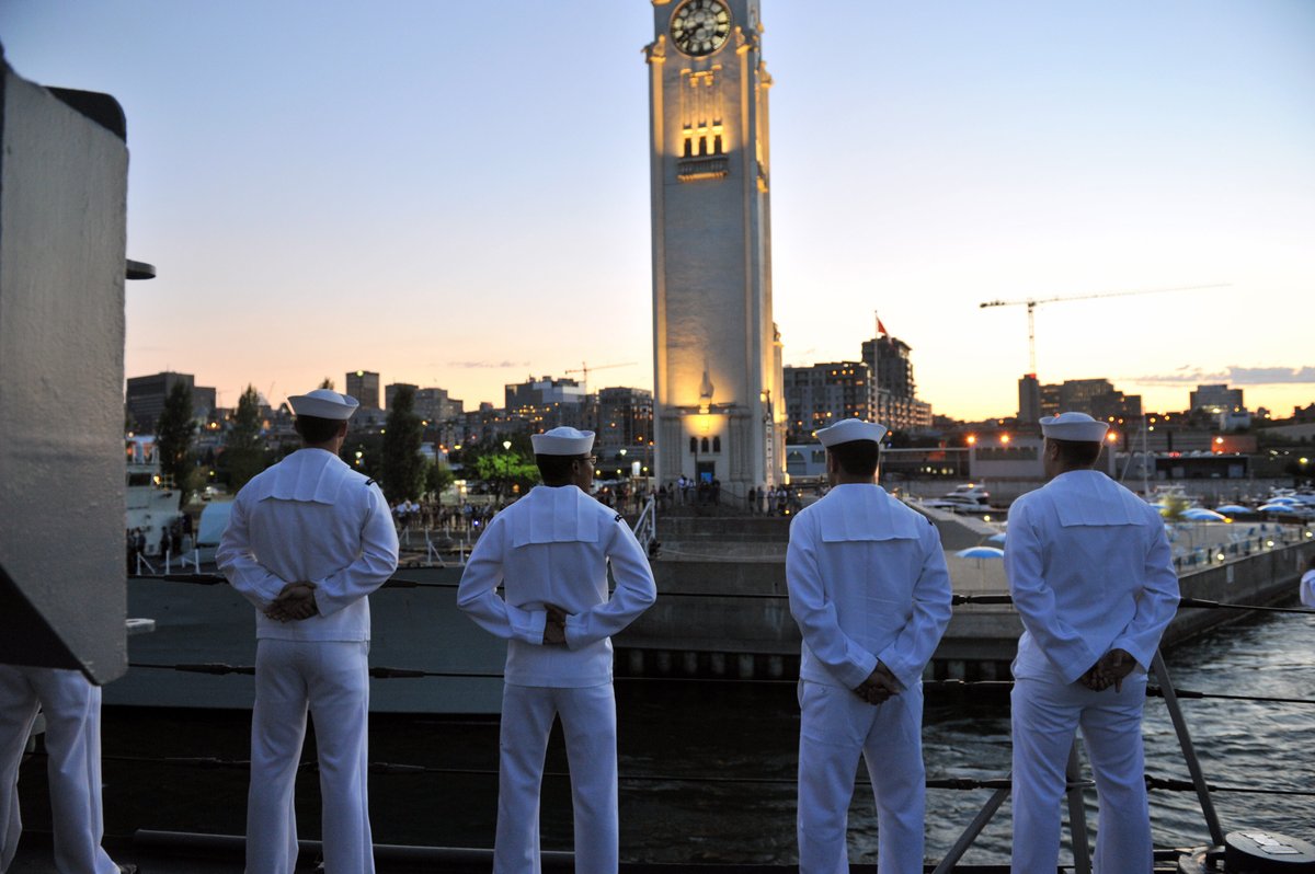 Sailors man the rails aboard the USS DeWert frigate arriving in Montreal
