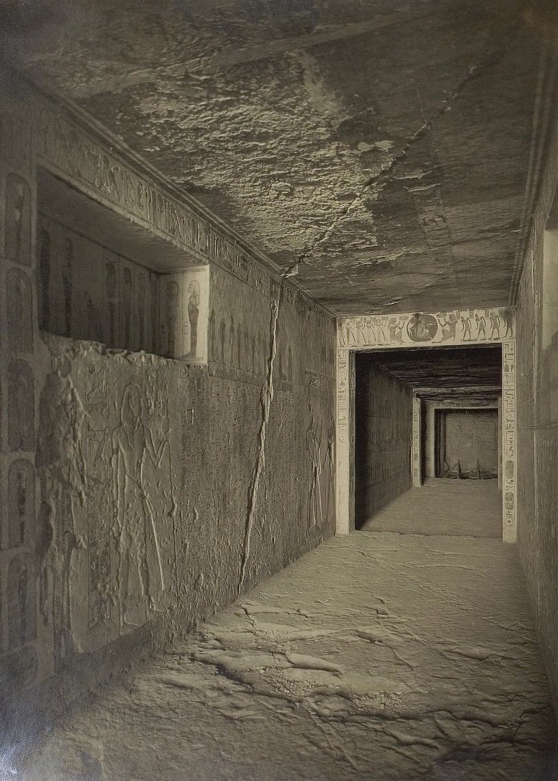 Black and white photograph of Tutankhamun's tomb excavation site with artifacts and structural details