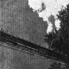 View from below of the Lushai bridge showing its structure and surroundings