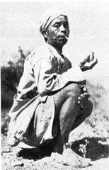 Lushai man smoking tobacco outdoors