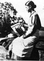 Lushai woman reading a western magazine