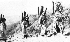 Lushai women carrying water in bamboo containers