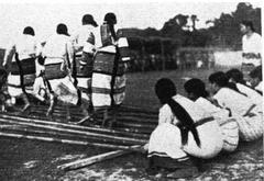 Lushai women performing Cheraw dance in traditional attire
