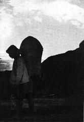 Lushai labourer performing early morning jhumming duties in a field